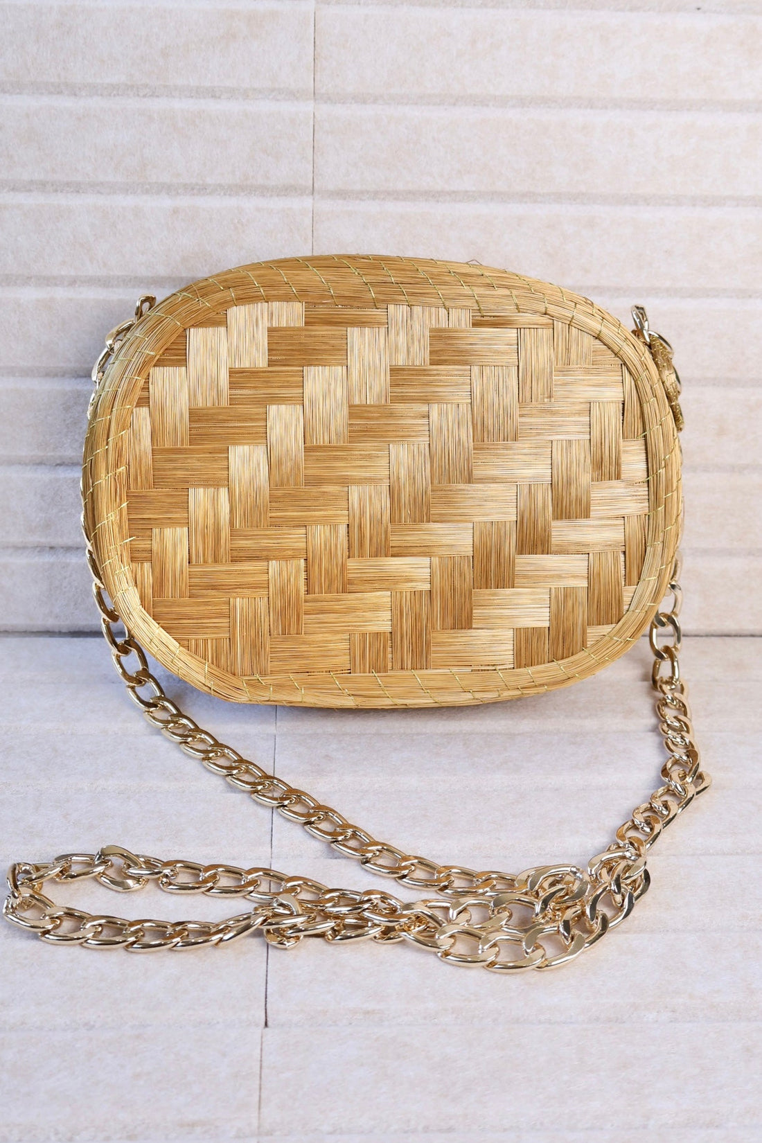 golden grass woven crossbody bag with gold chain zipper and velvet lining AquaBrasil