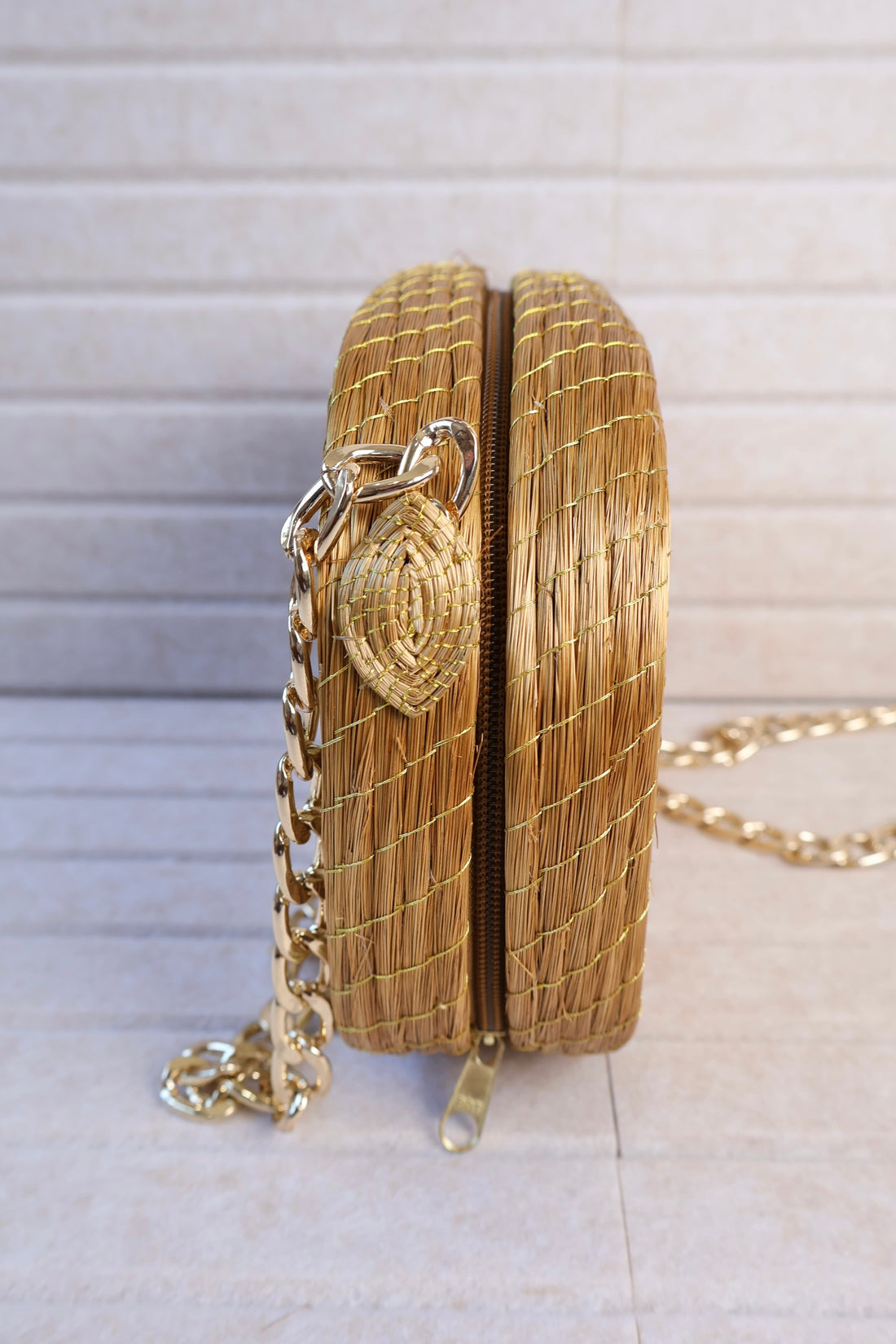 golden grass woven crossbody bag with gold chain zipper and velvet lining AquaBrasil