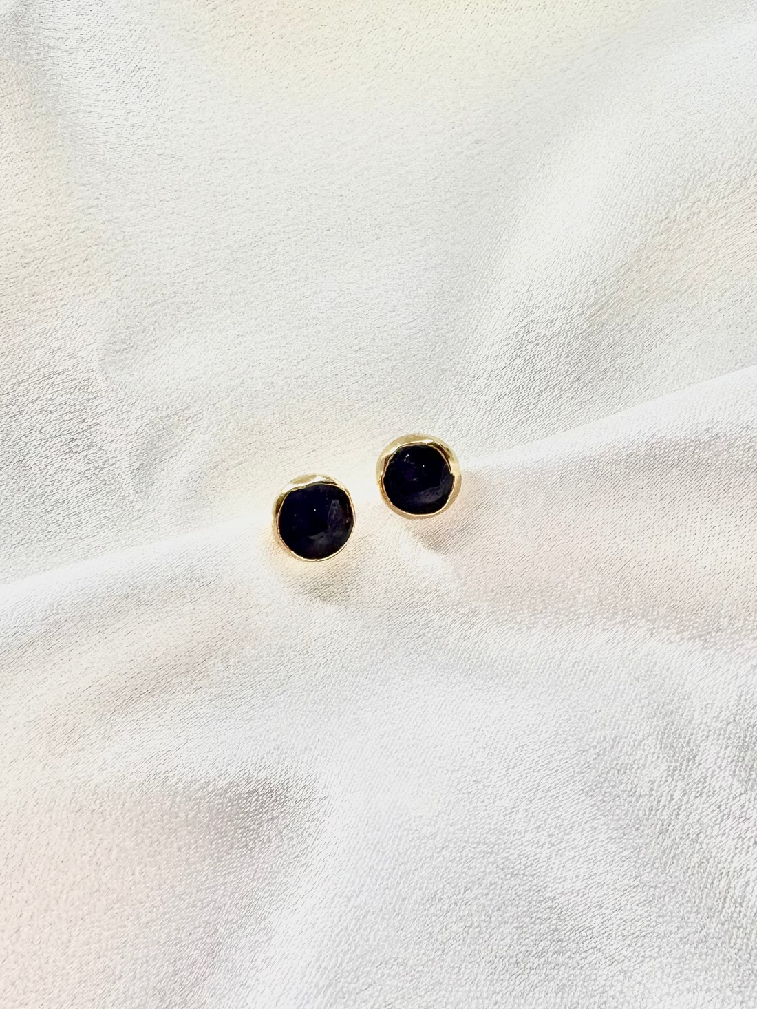 amethyst stud earrings with 18k plated edges. 