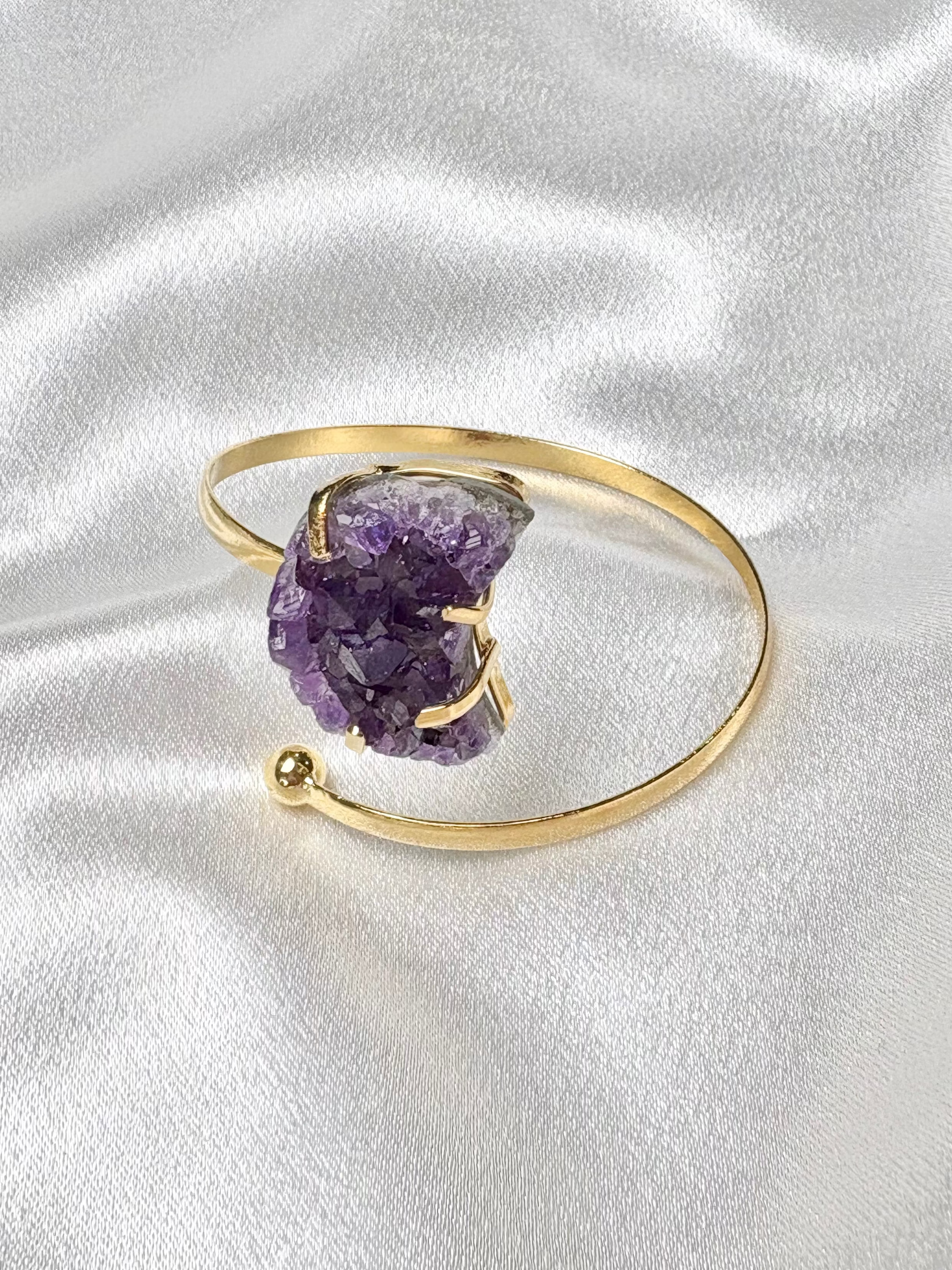 close up of amethyst moon shaped crystal cluster on gold plated adjustable cuff AquaBrasil jewelry
