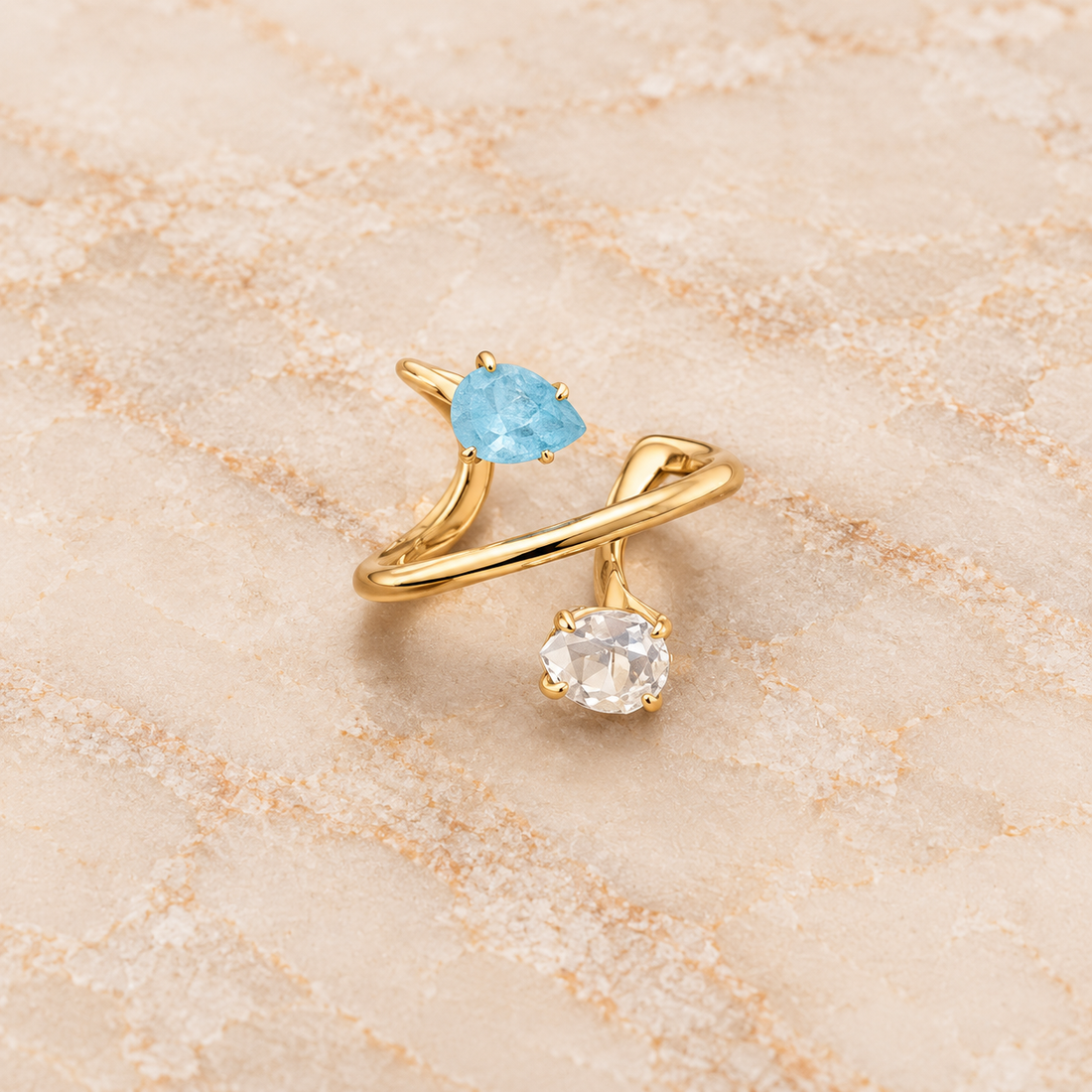 Aquamarine and Clear Quartz spiral ring with natural pear-shaped faceted gemstones and adjustable 18K gold-plated band