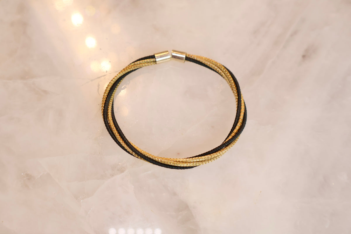 The Golden Bond Bracelet — Black Thread & Brazilian Golden Grass