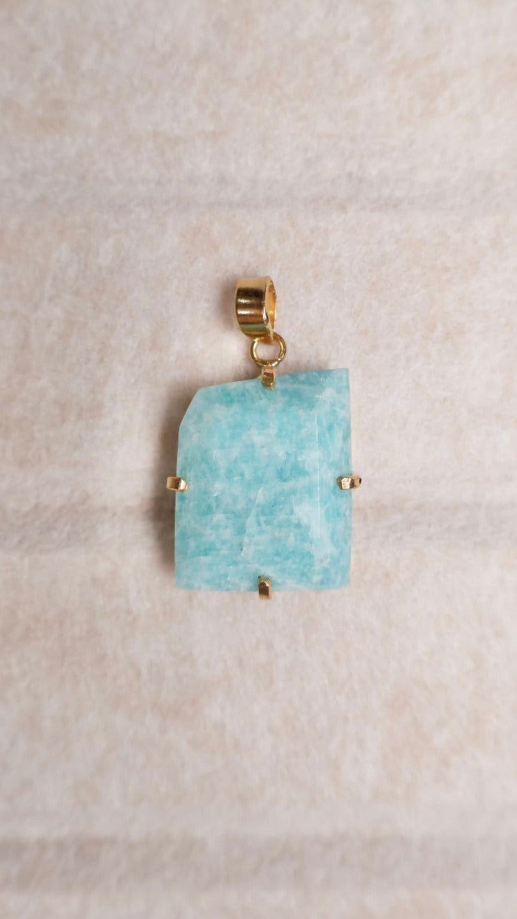 blue amazonite free form pendant displayed flat 18k gold plated frame AquaBrasil jewelry