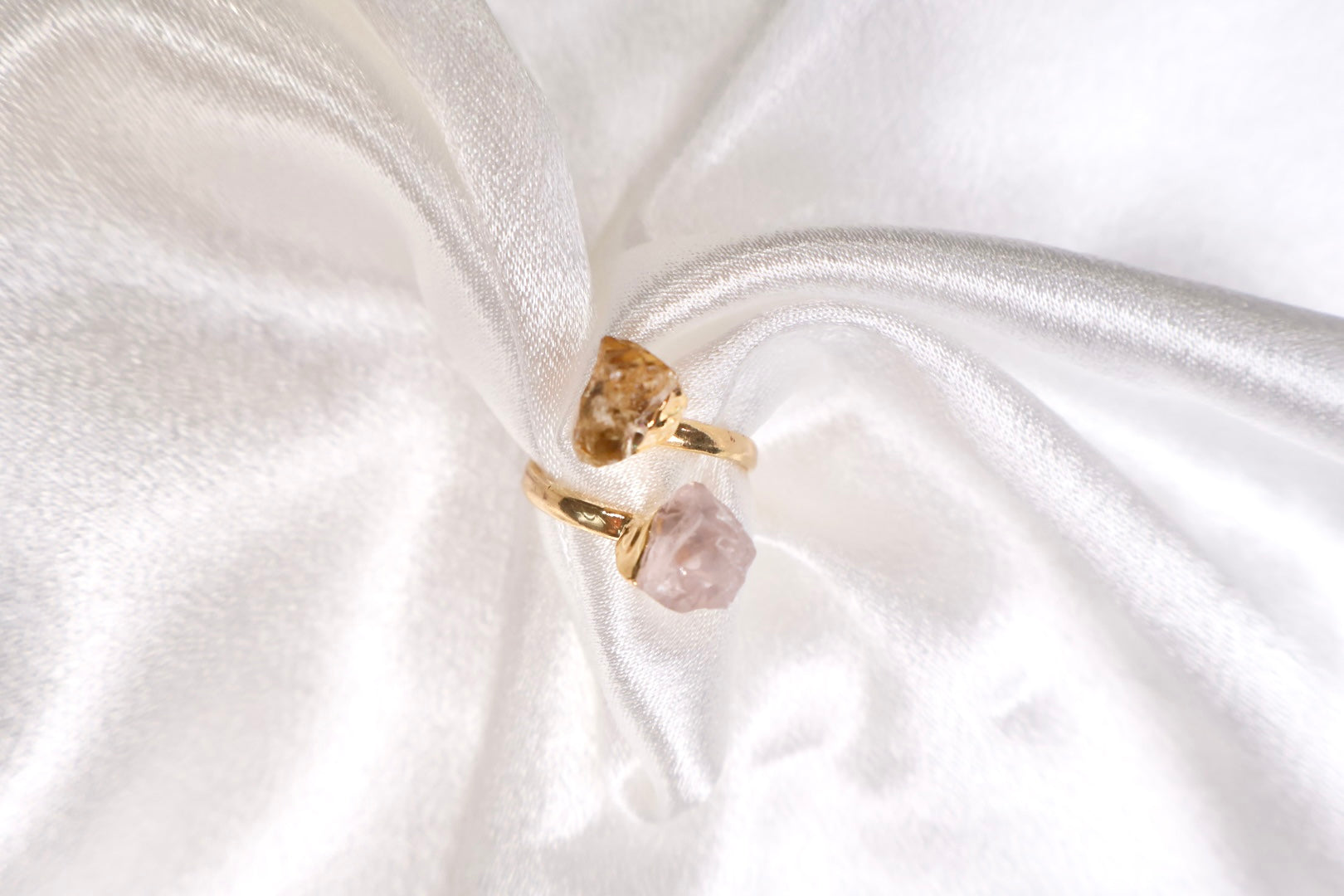 close up of citrine and rose quartz dual stone ring in 18k gold plating AquaBrasil