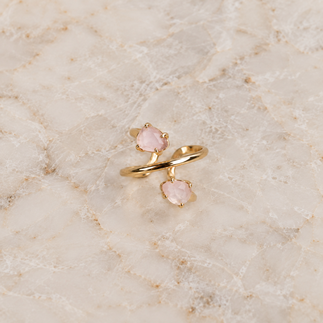 Double Rose Quartz spiral ring with two natural pear-shaped faceted gemstones and adjustable 18K gold-plated band