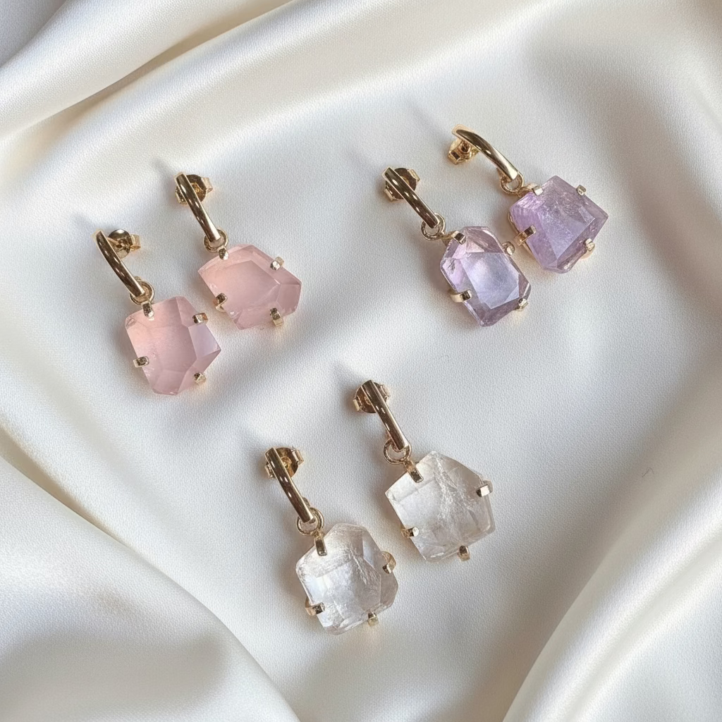 set of three faceted gemstone dropper earrings clear quartz rose quartz and amethyst with 18k gold plated details handcrafted by AquaBrasil