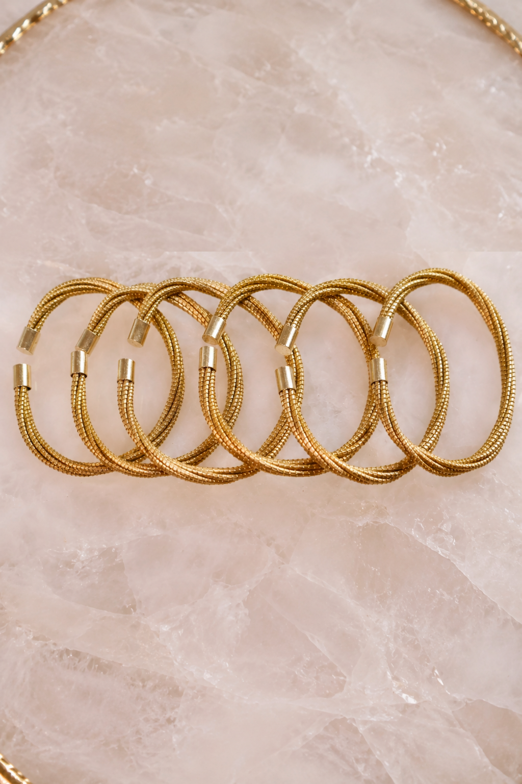 Golden Bond multi-strand bracelet handcrafted from Brazilian golden grass with 18K gold-plated ends
