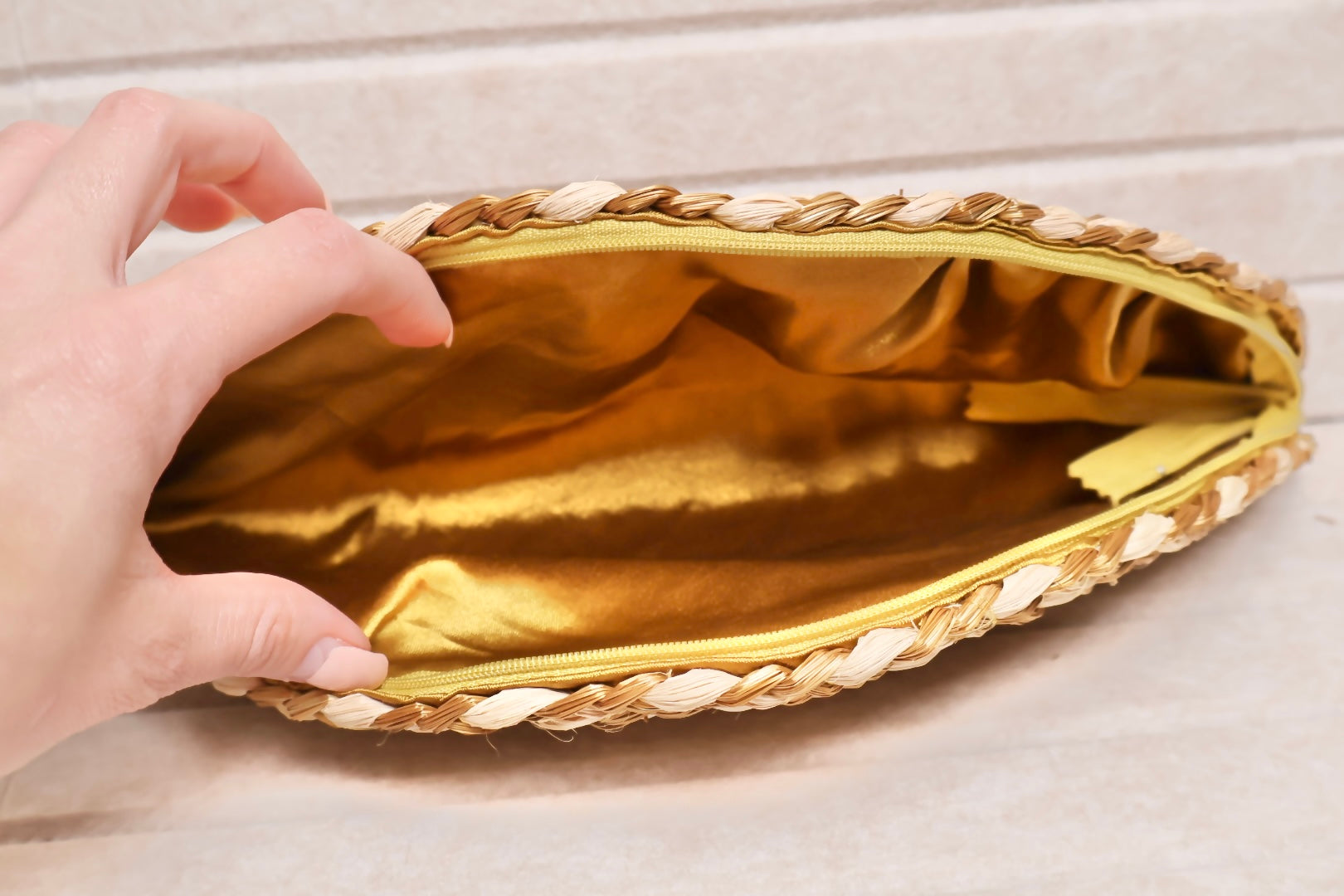 silk lining inside of golden grass and buriti clutch AquaBrasil