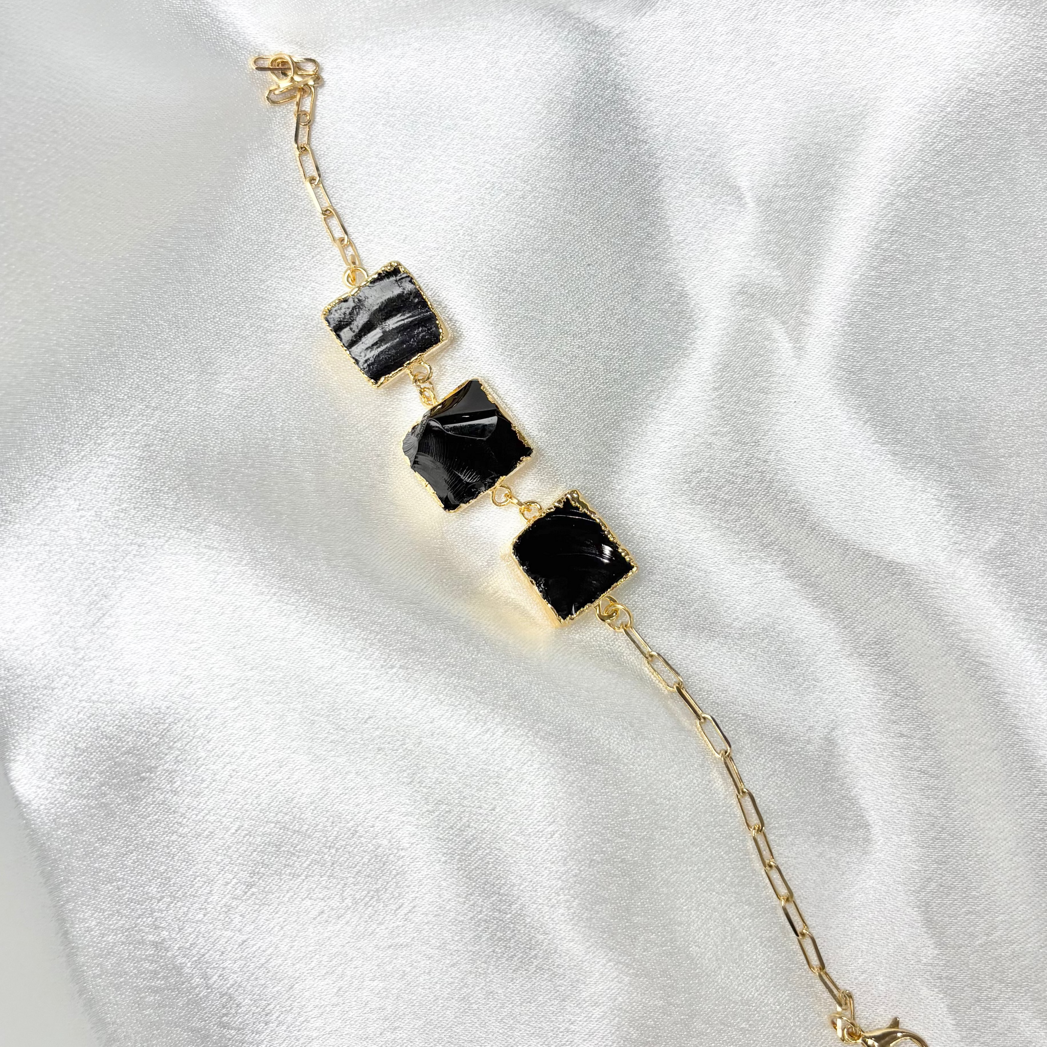 Obsidian bracelet with three black crystals on 18k gold plated chain handcrafted by AquaBrasil