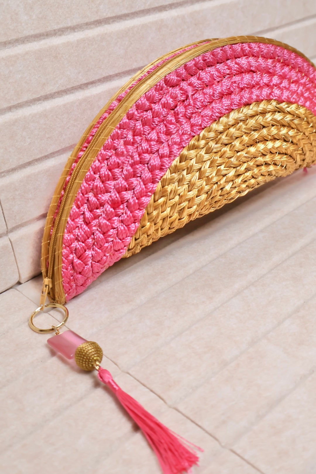 pink crochet and golden grass structured clutch with zipper closure AquaBrasil