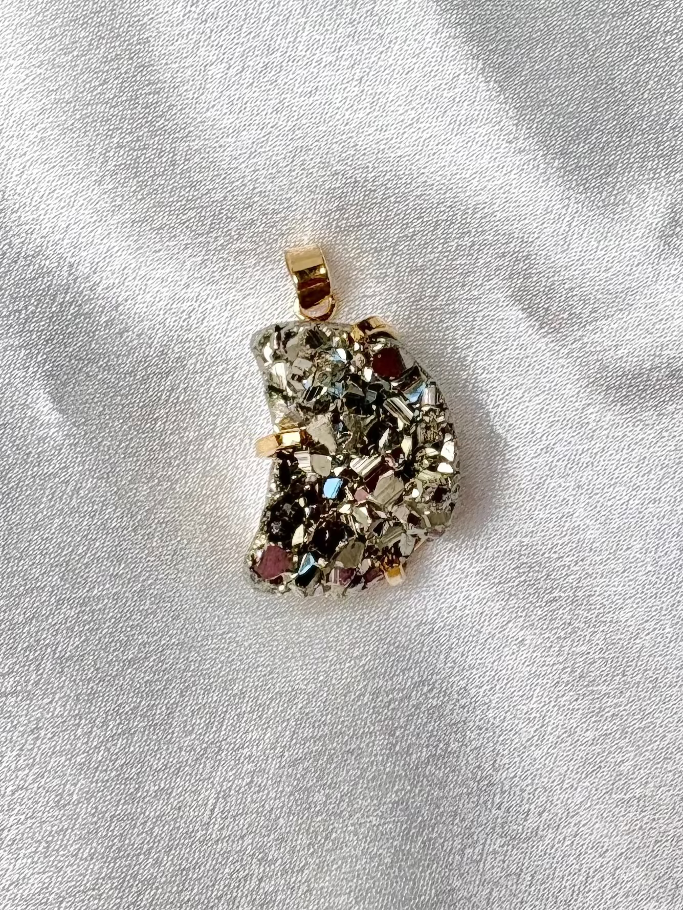 moon shaped pyrite pendant handcrafted in Brazil with natural stone and 18k gold plated details AquaBrasil jewelry