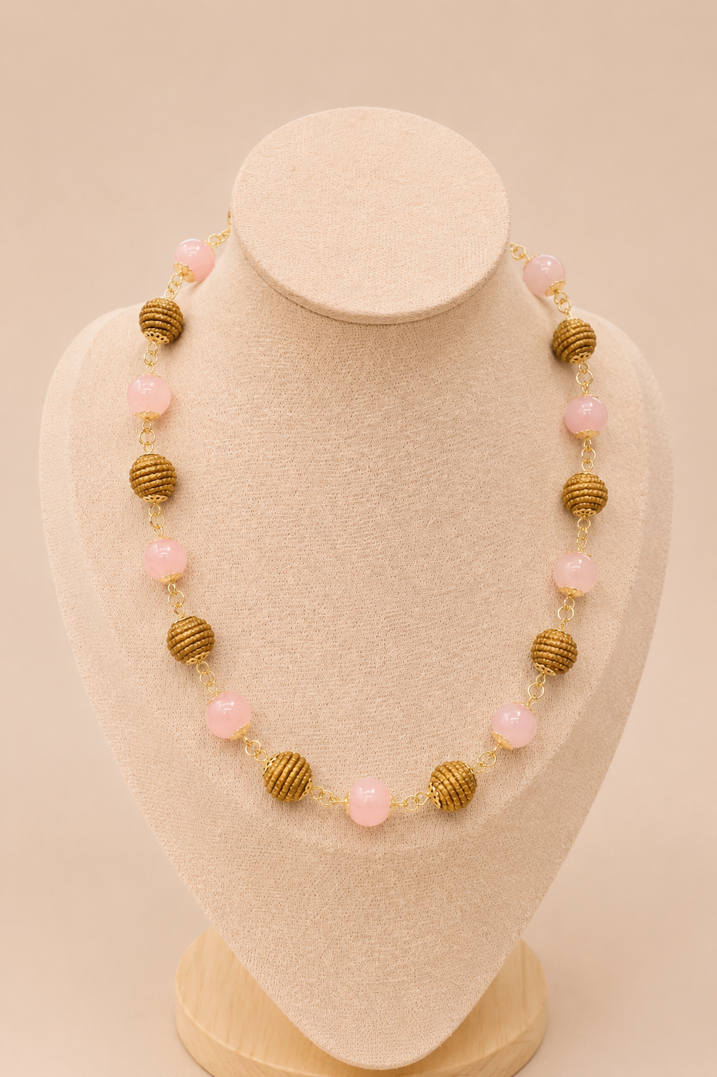 Natural Rose Quartz and handwoven Brazilian golden grass beaded necklace with 18K gold-plated details