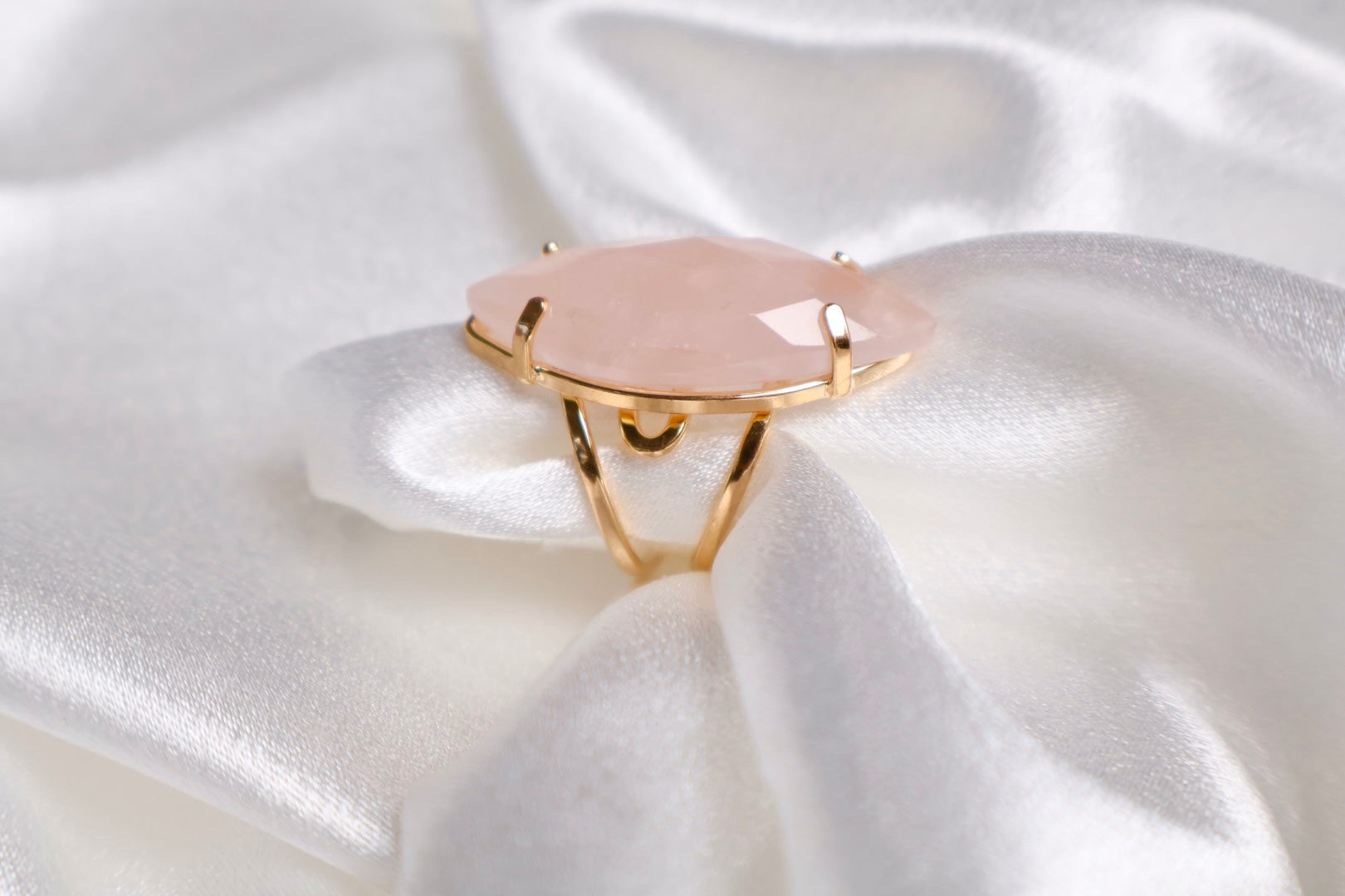 side view of faceted marquise rose quartz ring on 18k gold plated adjustable band AquaBrasil