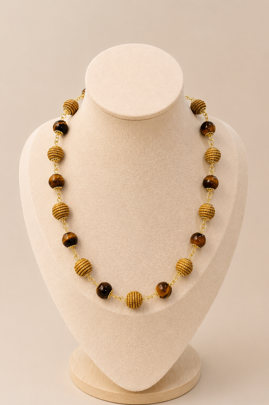 Natural Tiger Eye and handwoven Brazilian golden grass beaded necklace with 18K gold-plated details