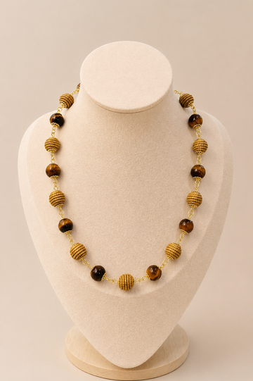 Natural Tiger Eye and handwoven Brazilian golden grass beaded necklace with 18K gold-plated details